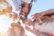 © Monstar Studio - People stay in circle enjoying refreshing beverage. Young men and women drink beer on festival, birthday. Happy friends spending free time together in park sitting on grass, drinking beer and chatting