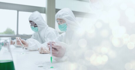Poster - Composition of scientists in ppe suits with test tubes working in laboratory and copy space
