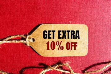 Wall Mural - GET EXTRA 10 OFF percent text on a brown tag on a red paper background