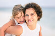 © sborisov - Portrait of happy mother and little daughter on ocean beach on Maldives at summer vacation. Family on the beach concept.