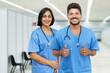© Daniel Ernst - Latin american male and female nurses at vaccination station