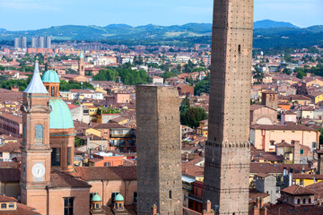 two famous falling bologna towers asinelli and garisenda. evening view, bologna, emilia-romagna, ita