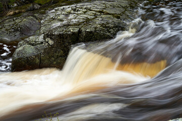 Sticker - Mesmerizing view of water flowing over rock with long exposure