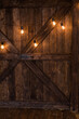 Decor from light bulbs on a wooden wall.