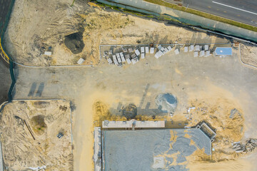 Panorama aerial view on foundation pitt he construction site of mounting concrete brick walls