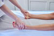 © Viacheslav Yakobchuk - Charming elegant female legs on the massage bed in room indoors