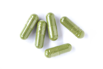 green pills isolated on white background