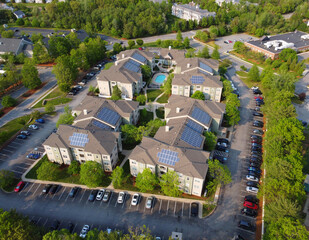 Poster - aerial view of apartment buildings with solar panel installed on roof 