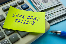Business Concept About SUNK COST FALLACY With Phrase On The Sheet.