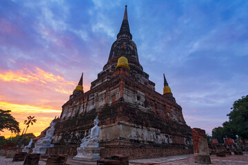 The pagoda and buddha status in sunrise at Wat Yai Chaimongkol, Ayutthaya of Thailand 