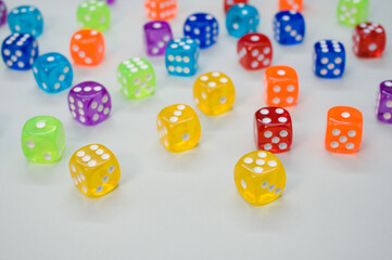 Wall Mural - High angle shot of colorful dices isolated on light gray background