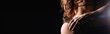 © LIGHTFIELD STUDIOS - partial view of muscular male hands passionately touching sexy female body in lingerie isolated on black, banner