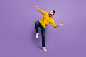 Sticker - Full length body size view of attractive cheerful man dancing having fun isolated over pastel violet purple color background