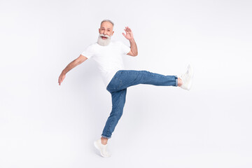 Poster - Full length body size view of nice funny cheerful man walking making step having fun isolated over light grey color background