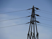 Utility Pole With Wires On A Blue Sky Background