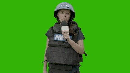 Sticker - GREEN SCREEN CHROMA KEY Caucasian female war journalist wearing protective helmet and bulletproof vest reporting live in front of the camera