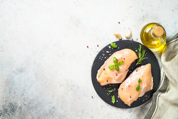 Wall Mural - Chicken fillet with spices and herbs at slatte board. Top view with copy space.