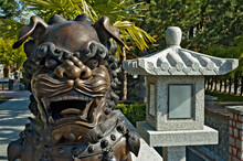 Shishi, Or Stylized Lion Guardian Outside A Buddhist Temple.