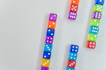 Wall Mural - Top view of colorful transparent dice on white background for a copy space