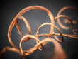 Closeup shot of a curvy copper wire