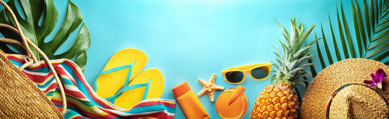 Wall Mural - Summer beach vacation and accessories on blue background