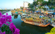 Flowers boat at flower market along canal wharf. This place Farmers sell apricot blossom and other flowers on Lunar New Year in Ho Chi Minh city, Vietnam