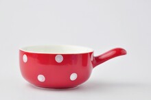 Close Up Red Cup With Polka Dots On White Background