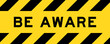Yellow and black color with line striped label banner with word be  aware