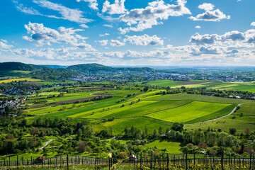 Germany, Panorama view above winnenden city houses surrounded by wide green nature landscape of fields and vineyards in summer