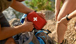 Young caucasian man holding first aid kit for healing