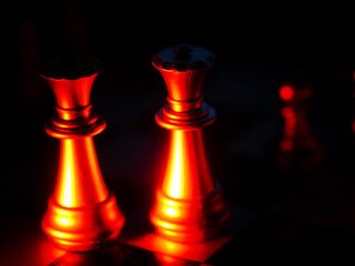 Canvas Print - Closeup shot of chess pieces in burning bright colors