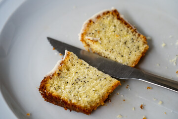 Sticker - Top view shot of a ceramic plate with a sweet bread that is cut in half and a knife