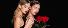 Sensual Woman Touching Shoulder Of Pretty Friend With Red Roses Isolated On Black, Banner.