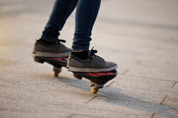 Wall Mural - Skateboarder legs skateboarding at outdoors