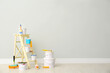 © New Africa - Decorator's kit of tools and paints near light wall indoors. Space for text