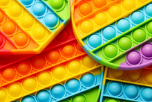 Rainbow pop it fidget toys as background, closeup