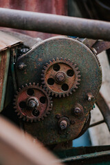 Canvas Print - Vertical shot of rusty gears from an old mechanism