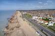 West Worthing seafront promenade and West Parade road heading along the beach towards Goring by Sea. Aerial view.