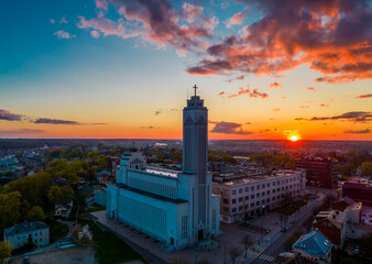 Poster - Amazing red sunset view over the Kaunas our Lord Jesus Christ's Resurrection Basilica. It is the largest basilical church in the Baltic States. Aerial drone photo