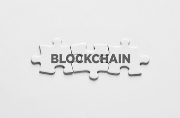 Blockchain technology. The word blockchain on connected jigsaw puzzles.