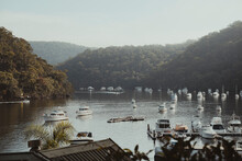 An Idyllic Scene Of Boats Sitting On The Calm Water At Berowra Waters, NSW.