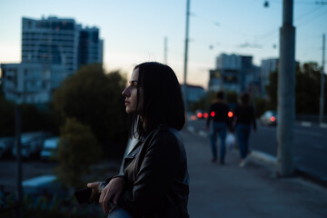 Beautiful woman evening portrait in the city