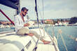 Relaxed businessman working on the yacht