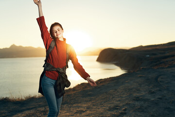 woman hiker backpack in travel landscape sunset lifestyle