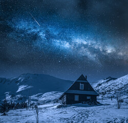 Wall Mural - Milky way over cottage in Gasienicowa valley at winter.