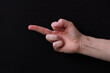 © Fernando - hand pointing on black background