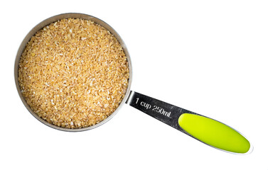 Wall Mural - raw wheat groats in measuring cup cutout