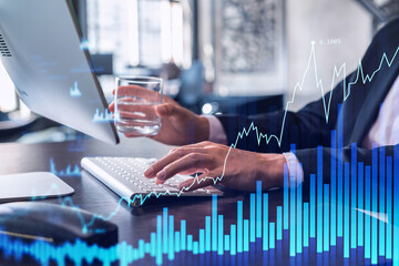 Wall Mural - Hands typing the keyboard to research stock market to proceed right investment solutions. Internet trading and wealth management concept. Formal wear. Hologram Forex chart over close up shot.