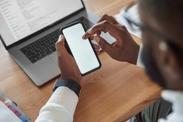 Closeup african american male hand swiping on mobile phone screen overhead view