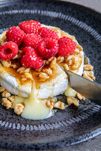 Baked Brie With Raspberries And Walnuts